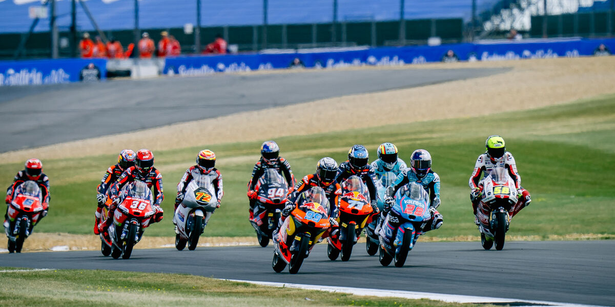 A group of motorcycle racers on a race track