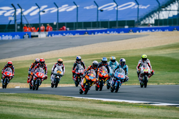 A group of motorcycle racers on a race track